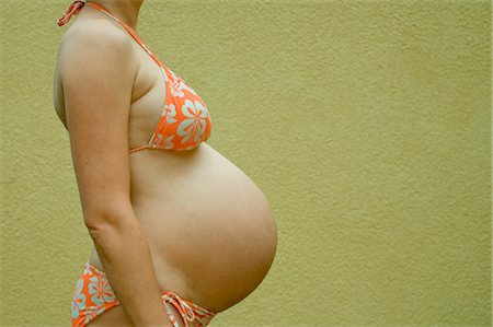 female belly expansion - Profile of Woman, Nine Months Pregnant Stock Photo - Premium Royalty-Free, Code: 600-02922774