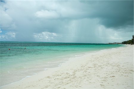 raining on the beach photos - Rainstorm Rolling in Over Beach, Turks and Caicos Stock Photo - Premium Royalty-Free, Code: 600-02935370