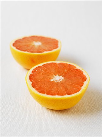 fruit of orange color - Grapefruit Halves Stock Photo - Premium Royalty-Free, Code: 600-02957576