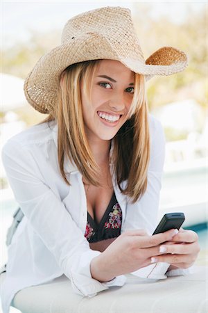 female cowboy hat - Portrait of Woman Using Phone Stock Photo - Premium Royalty-Free, Code: 600-02957692