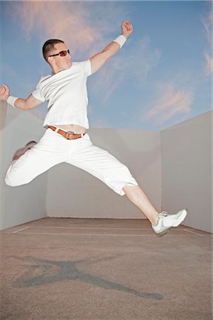 posing model man - Man Jumping Up in the Air Stock Photo - Premium Royalty-Free, Code: 600-02973189