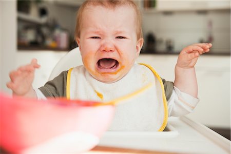 sad young boy - Crying Baby in High Chair Stock Photo - Premium Royalty-Free, Code: 600-03004392