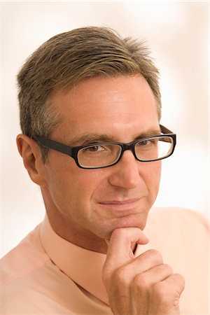 face of 40 year old man - Portrait of Businessman Wearing Glasses Stock Photo - Premium Royalty-Free, Code: 600-03005090