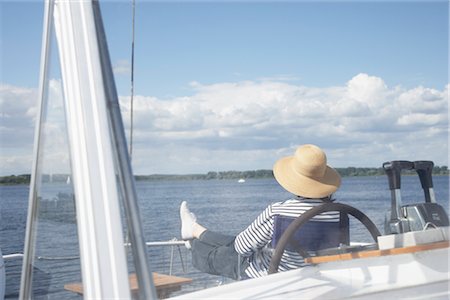 simsearch:700-05780989,k - Woman Sitting on Boat Fotografie stock - Premium Royalty-Free, Codice: 600-03017266