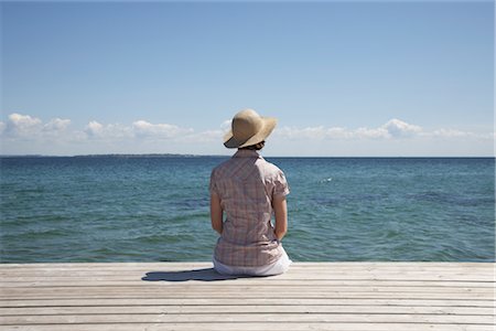 Woman Sitting at End of Dock Stock Photo - Premium Royalty-Free, Code: 600-03017287