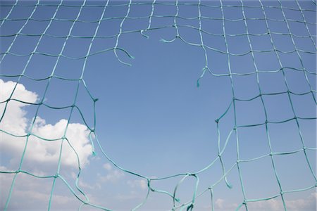 rede (material) - Hole in Soccer Net Foto de stock - Royalty Free Premium, Número: 600-03017281