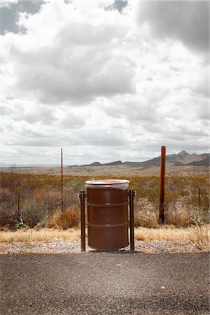 Garbage Can on Side of the Road, Shafter, Texas, USA Stock Photo - Premium Royalty-Free, Code: 600-03017327