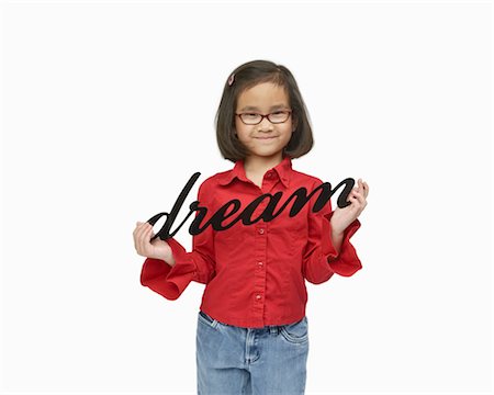 Girl Holding Dream Sign Stock Photo - Premium Royalty-Free, Code: 600-03017567