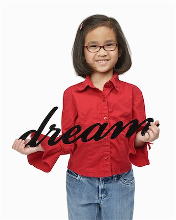 Girl Holding Dream Sign Stock Photo - Premium Royalty-Free, Code: 600-03017568