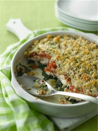 simsearch:700-03053783,k - Baked Pickerel Casserole With Breadcrumbs, Tomato and Spinach Stock Photo - Premium Royalty-Free, Code: 600-03017753