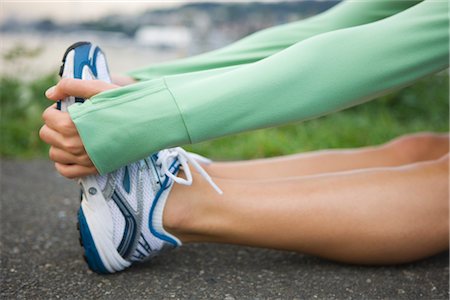 foot in sneakers - Woman Stretching, Seattle, Washington, USA Stock Photo - Premium Royalty-Free, Code: 600-03017918