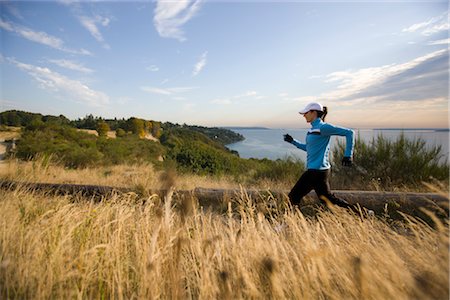Woman Running near Puget Sound, Seattle, Washington, USA Stock Photo - Premium Royalty-Free, Code: 600-03017927
