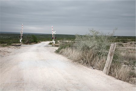 railroad arid - Railroad Crossing, Amistad National Recreation Area, Texas, USA Stock Photo - Premium Royalty-Free, Code: 600-03054124