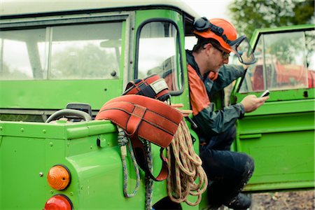 rest man phone - Tree Surgeon Using Cell Phone Stock Photo - Premium Royalty-Free, Code: 600-03053770