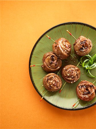 simsearch:600-03738382,k - Teriyaki Beef Pinwheels with Sesame Seeds and Green Onion Garnish Stock Photo - Premium Royalty-Free, Code: 600-03053824