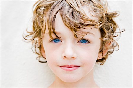 Boy With Blonde Curly Hair And Blue Eyes Stock Photos Page 1