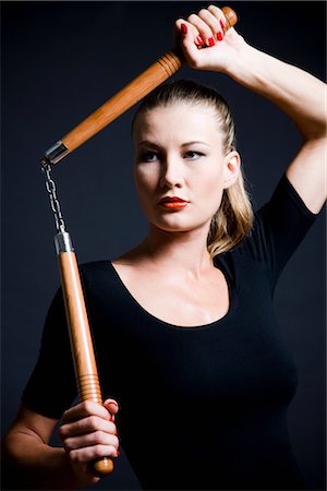 energetic fashion female - Femme tenant des nunchakus Photographie de stock - Premium Libres de Droits, Code: 600-03075370