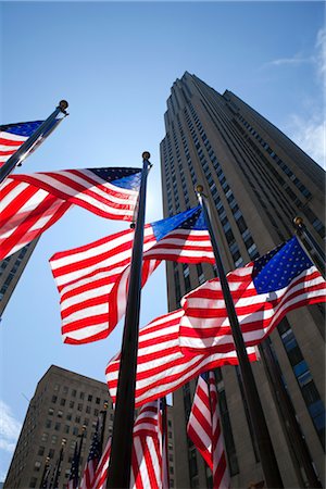 American Flags at Rockefeller Center, GE Building in the Background, NYC, New York, USA Stock Photo - Premium Royalty-Free, Code: 600-03075824