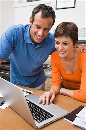 Couple Paying Bills Online Stock Photo - Premium Royalty-Free, Code: 600-03076094