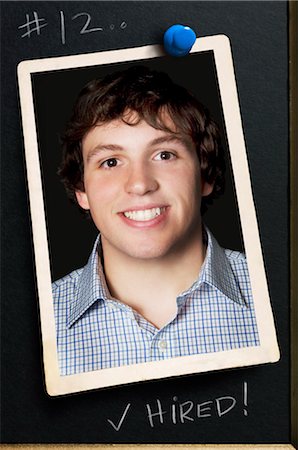 Photograph of Young Man Pinned to Bulletin Board Foto de stock - Sin royalties Premium, Código: 600-03152486