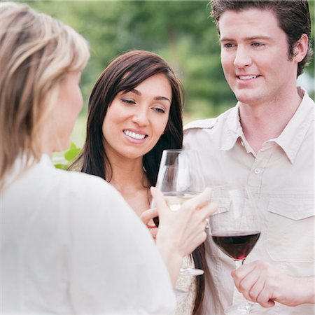 Group of People Outdoors Drinking Wine Stock Photo - Premium Royalty-Free, Code: 600-03153015