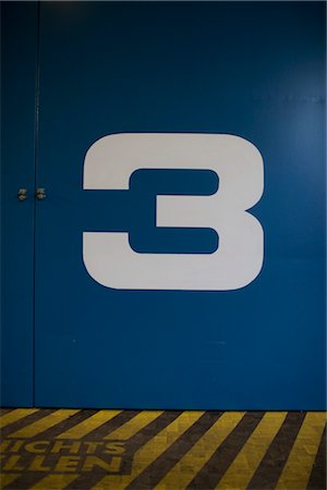 factory indoor signage - Close-up of the Number Three on a Door Stock Photo - Premium Royalty-Free, Code: 600-03178786