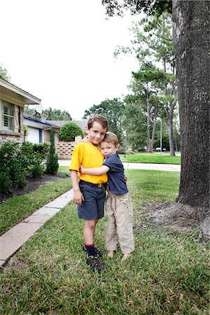 young boys hugging