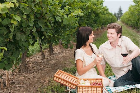 Couple Having a Picnic in a Vineyard Stock Photo - Premium Royalty-Free, Code: 600-03179147