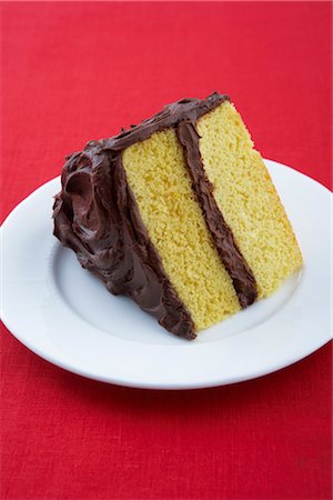 Slice of Cake with Chocolate Icing Foto de stock - Sin royalties Premium, Código: 600-03194971