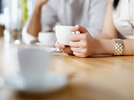 person drinking cup of coffee - Woman Drinking a Cup of Coffee at Wine Bar, Toronto, Ontario, Canada Stock Photo - Premium Royalty-Free, Code: 600-03230241