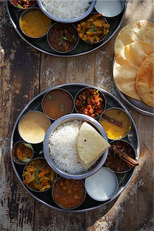 Thali, Rasam, Chana Masala, Kadai Bhindi, Mixed Vegetable Curry, Sambhar, Saag Paneer, Payasam, and Mixed Pickle Stock Photo - Premium Royalty-Free, Code: 600-03244075