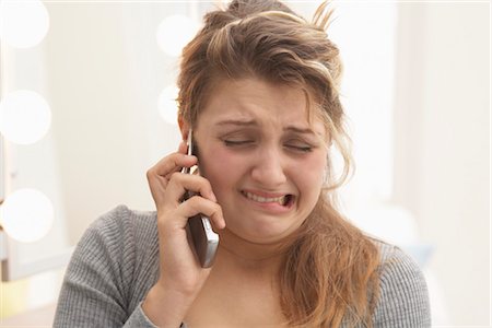 Gros plan de femme parlait au téléphone cellulaire Photographie de stock - Premium Libres de Droits, Code: 600-03244231