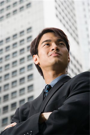 empowering - Businessman in front of High Rise Building Stock Photo - Premium Royalty-Free, Code: 600-03333326