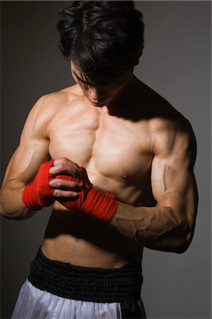 Male Boxer with Head Lowered Foto de stock - Sin royalties Premium, Código: 600-03333329