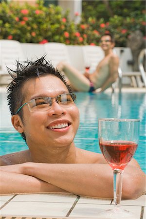 east asian (male) - Man in Pool with Glass of Wine Stock Photo - Premium Royalty-Free, Code: 600-03333359