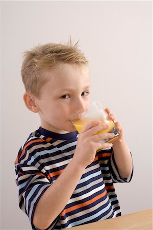 striped - Boy Drinking Orange Juice Stock Photo - Premium Royalty-Free, Code: 600-03368370