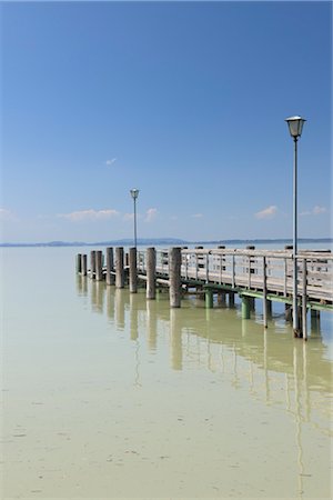 dock posts - Dock on Lake Chiemsee, Chieming, Bavaria, Germany Stock Photo - Premium Royalty-Free, Code: 600-03361610
