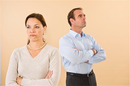 dress shirt male arms crossed - Angry Couple in Studio Stock Photo - Premium Royalty-Free, Code: 600-03404021