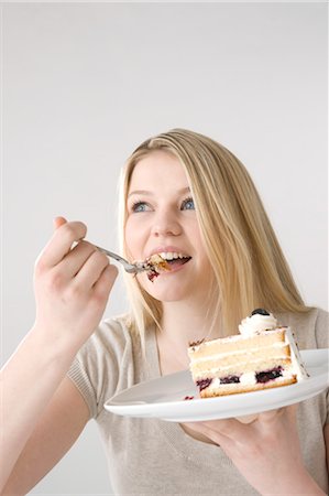 desserts on white plate - Woman Eating Cake Stock Photo - Premium Royalty-Free, Code: 600-03404058