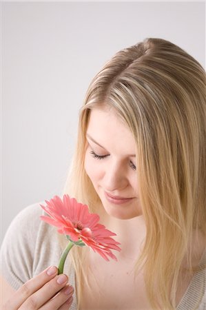 ecstatic (extreme happiness) - Woman Smelling Flower Stock Photo - Premium Royalty-Free, Code: 600-03404053