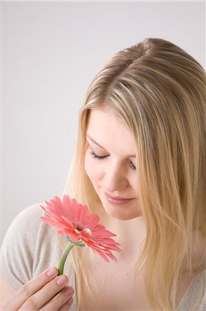 Woman Smelling Flower Stock Photo - Premium Royalty-Free, Code: 600-03404053