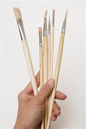 simsearch:600-03161695,k - Person Holding Paintbrushes Foto de stock - Sin royalties Premium, Código: 600-03404105