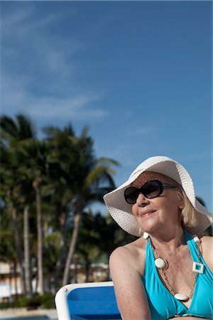 senior woman swimming pool - Woman Sunbathing by Pool, Cayo Coco, Cuba Stock Photo - Premium Royalty-Free, Code: 600-03404169