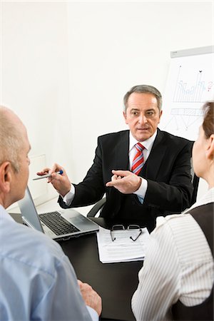 serious counselor talking with person - Businesspeople in Consultation Stock Photo - Premium Royalty-Free, Code: 600-03404531