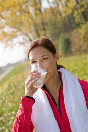 fitness drink - Portrait of Woman Drinking Milk Stock Photo - Premium Royalty-Free, Code: 600-03404923