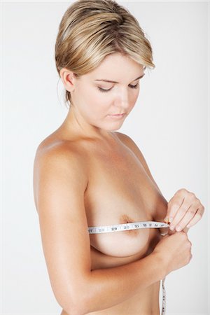 Woman Measuring Breasts Foto de stock - Sin royalties Premium, Código: 600-03405618