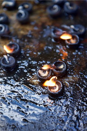 praying indian - Candles at Brihadishwara Temple, Thanjavur, Tamil Nadu, India Stock Photo - Premium Royalty-Free, Code: 600-03445303