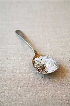 spoon of salt with peppercorns - Sea Salt Flakes & Cracked Black Pepper on Vintage Spoon Stock Photo - Premium Royalty-Free, Code: 600-03445429