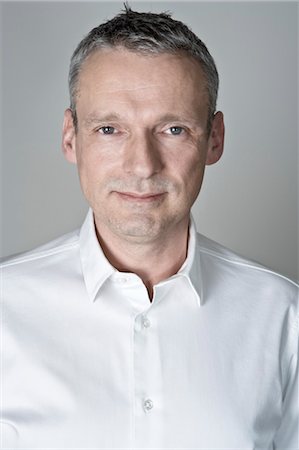 Portrait of Man wearing White Shirt Stock Photo - Premium Royalty-Free, Code: 600-03445605