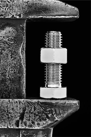 simsearch:600-00150356,k - Nut and Bolt in Wrench Stock Photo - Premium Royalty-Free, Code: 600-03446208